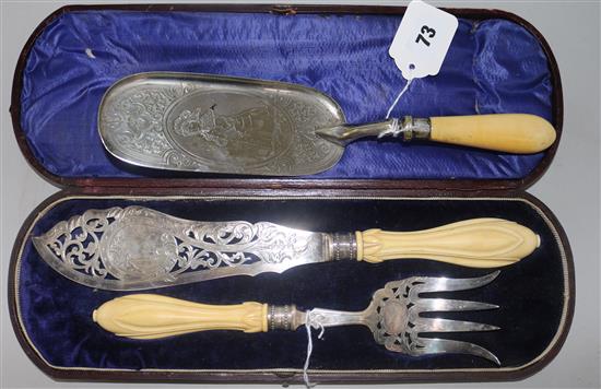 A pair of plated and ivory-handled fish servers, cased and a similar crumb scoop